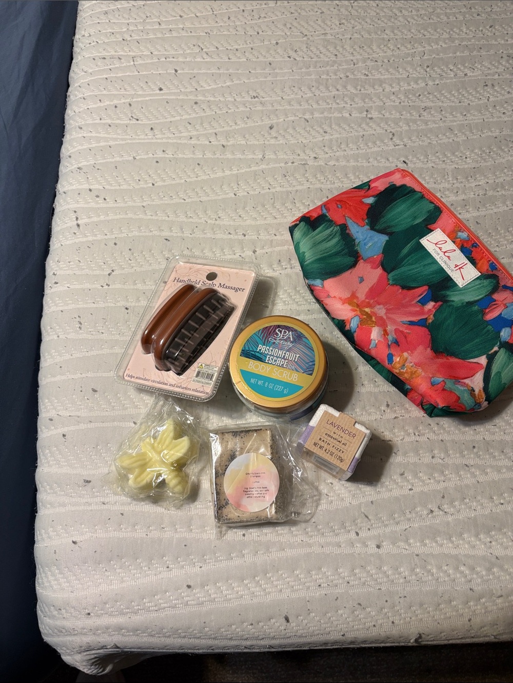 Floral Pouch with body scrub, scalp massage, bath fizzy, coffee shampoo and soap